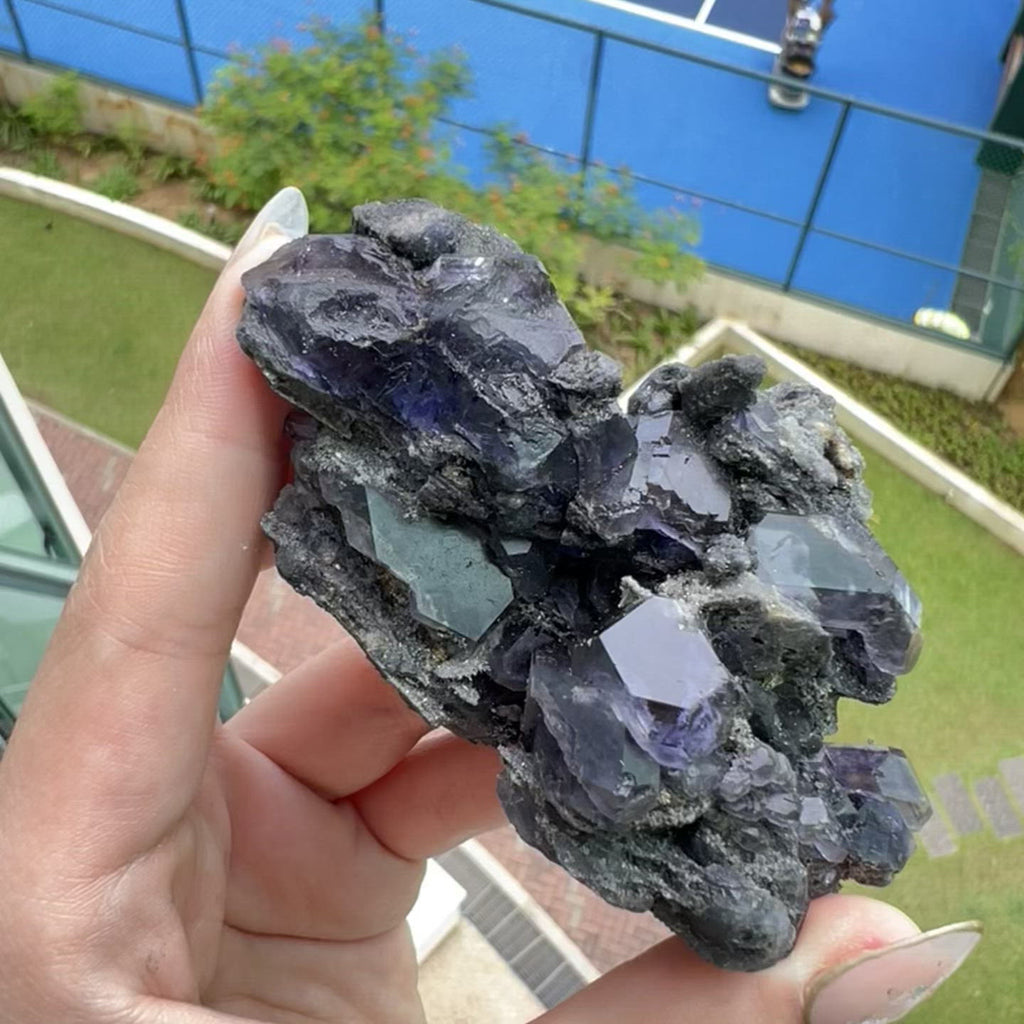 Ethically sourced fluorite specimen with tanzanite purple gemmy formations