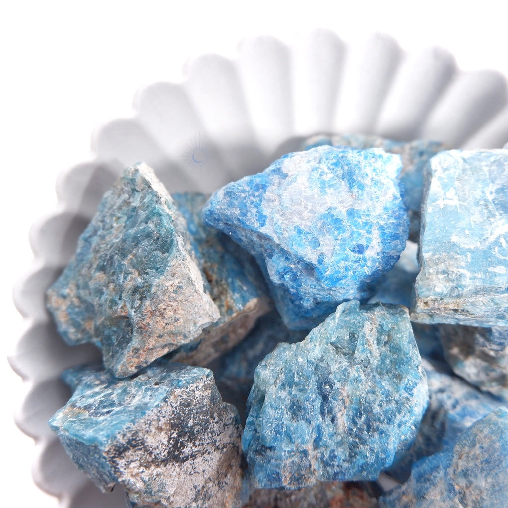 Bowl of bright blue raw apatite crystal chunk