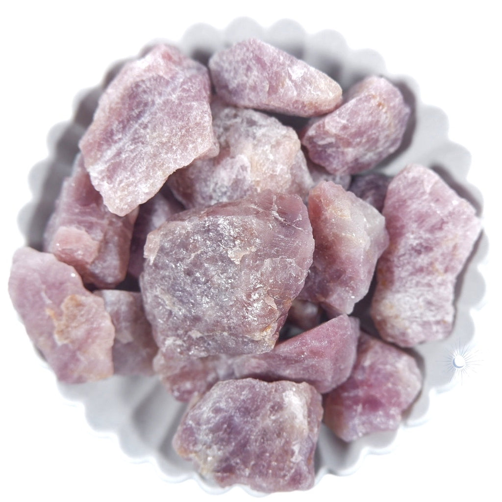 Bowl of raw purple lavender rose quartz from madagascar