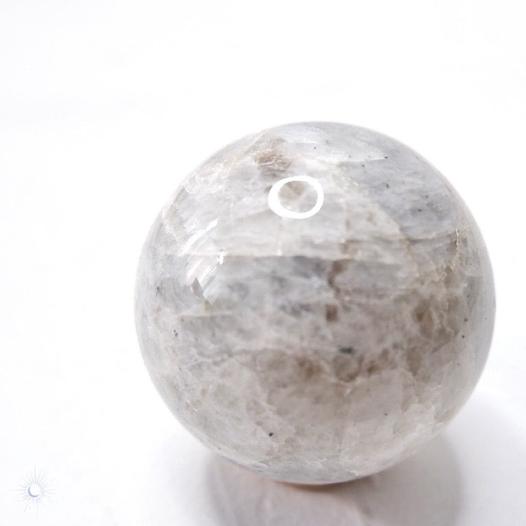 Ethically sourced blue flash rainbow moonstone sphere from India by Tsukiyo Co for fertility crystals
