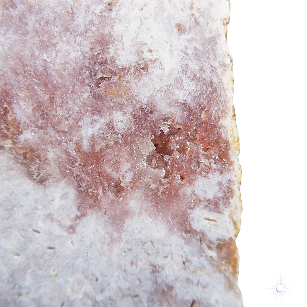 Close up of pink druzy on ethically sourced pink amethyst druzy slab from brazil on metal stand