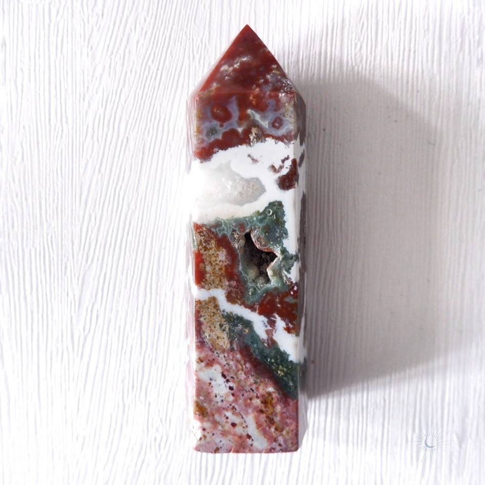 front druzy view of Scenic pink, maroon and green ocean jasper obelisk with druzy and white banding