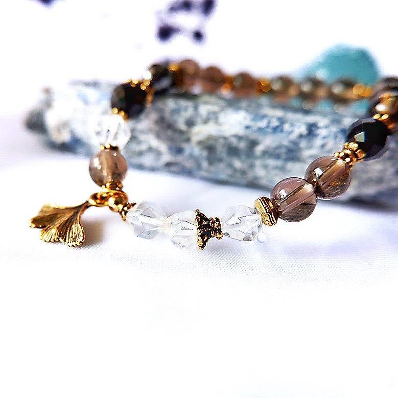 Close up of Handmade beaded crystal bracelet with natural crystal and Tierracast Gingko Charm by Tsukiyo Singapore