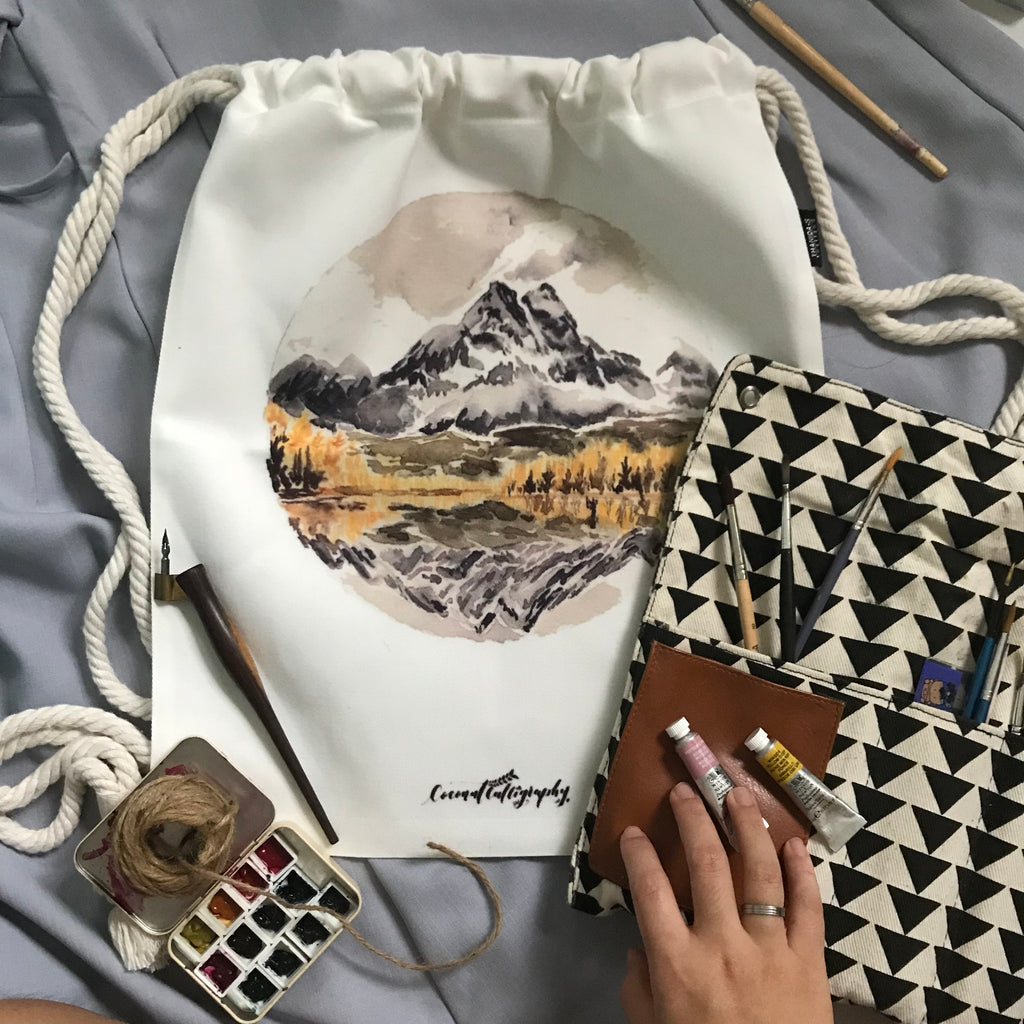 Landscape drawstring bag featuring Pyramid Lake USA by CoconutCalligraphy
