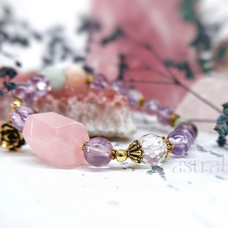 Side view of Time for Tea Tranquility bracelet by Astral by Tsukiyo, featuring the large rose quartz bead and faceted clear quartz bead