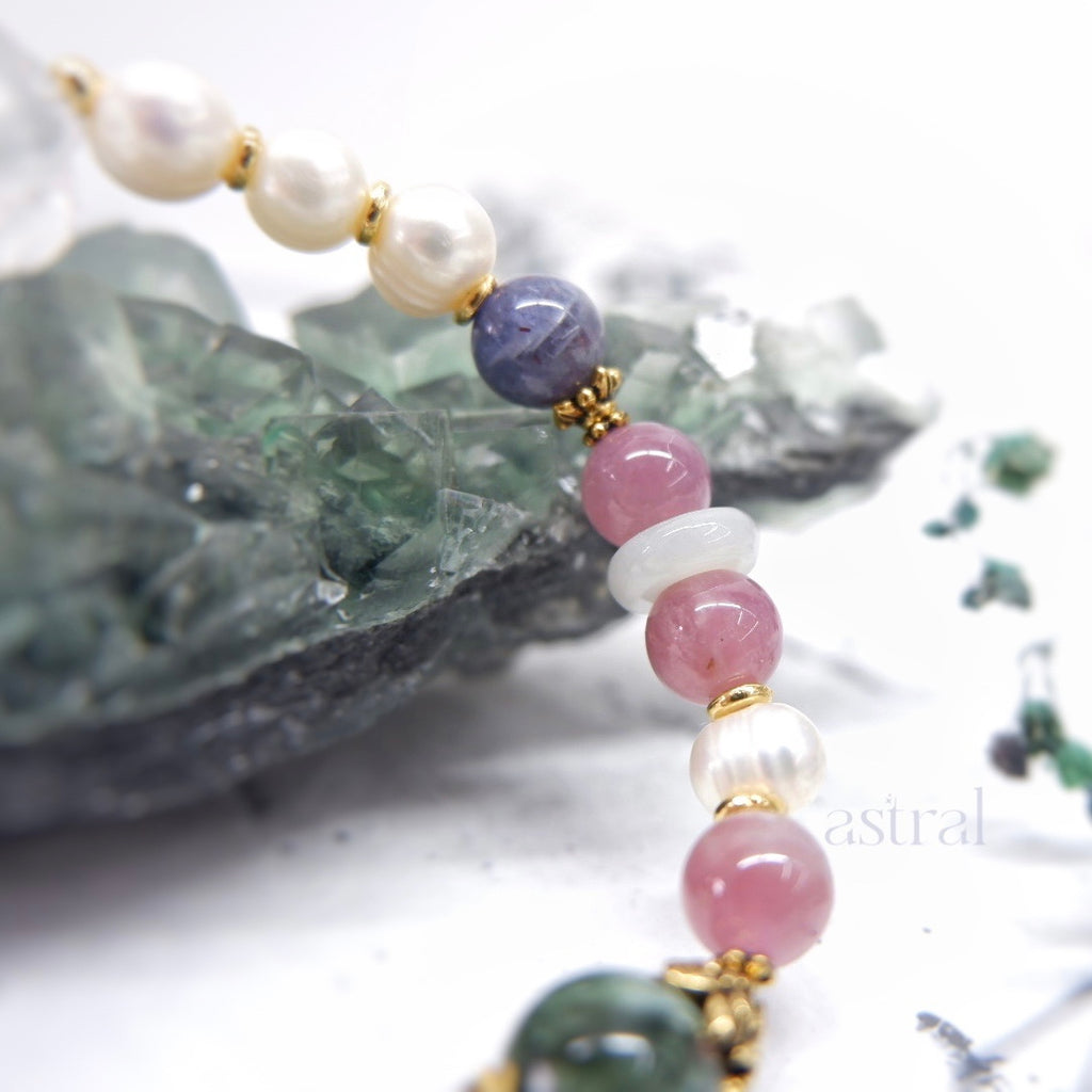 Close up view of lure me in bracelet by Astral by Tsukiyo, featuring jadeite runner and lavender rose quartz beads